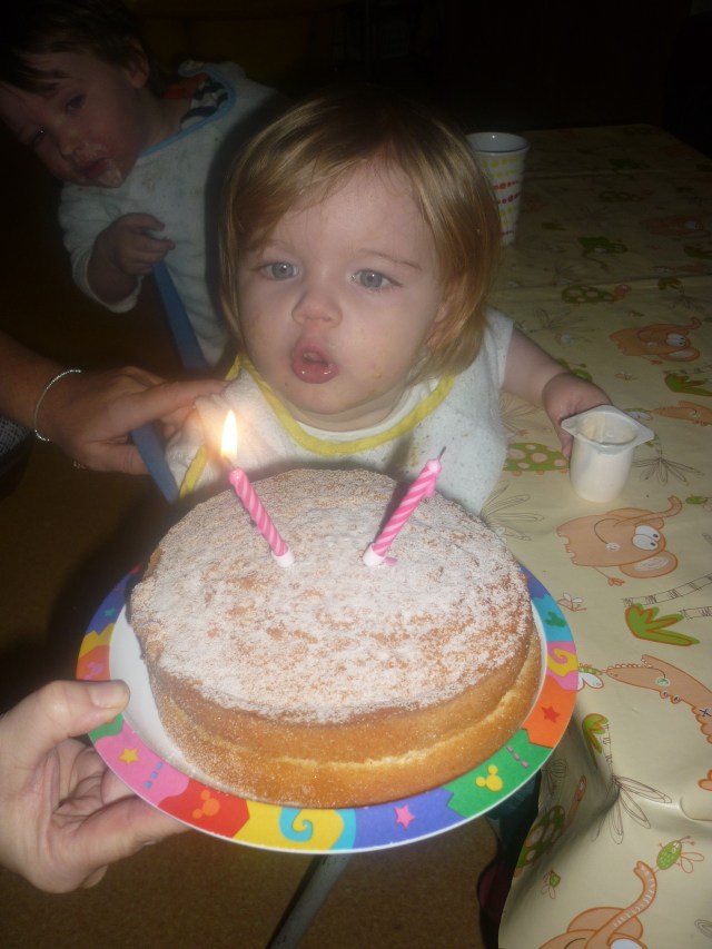 She didn't want to wear the fancy birthday hat but loved blowing out her 2 candles today. Happy 2nd Birthday to our wee Layla.