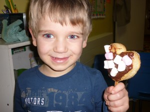 Here is Alex with his valentine lolly biscuit made for a special treat. "I want to make one for my Helena too"