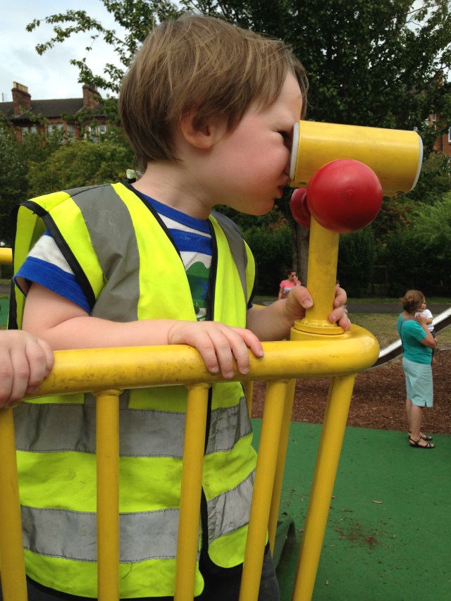 Tom using the binoculars in the park to see if he could see his free educational hours on the horizon. All he could see was a maze of trees and swings and roundabouts. There was no "transparency".