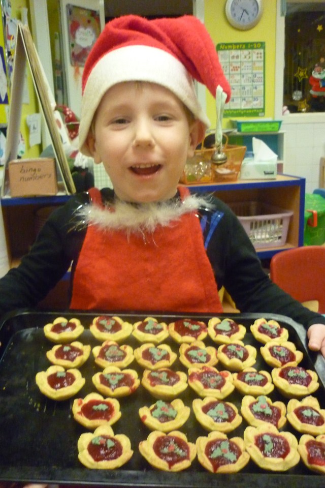 We did ofcourse!! We made these cranberry pies from scratch. We made the sauce and the biscuit part. Then we made a Christmas Cafe for our families and served them up on a plate.