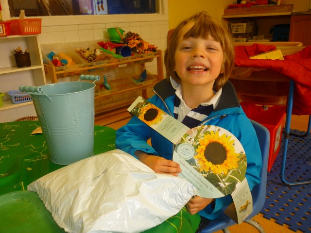 We have been doing loads of planting and growing these past few weeks. We planted our apple tree in the Meadow, also some bedding plants there too. We have planted tomato plants and runner beans. Now we have some sunflower seeds growing. How happy does Sandy look?